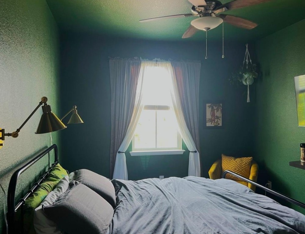 14110 Luisium View, Unit 72 Pflugerville, TX 78660 - Photo 11 of 21 a bedroom with a bed and a chandelier