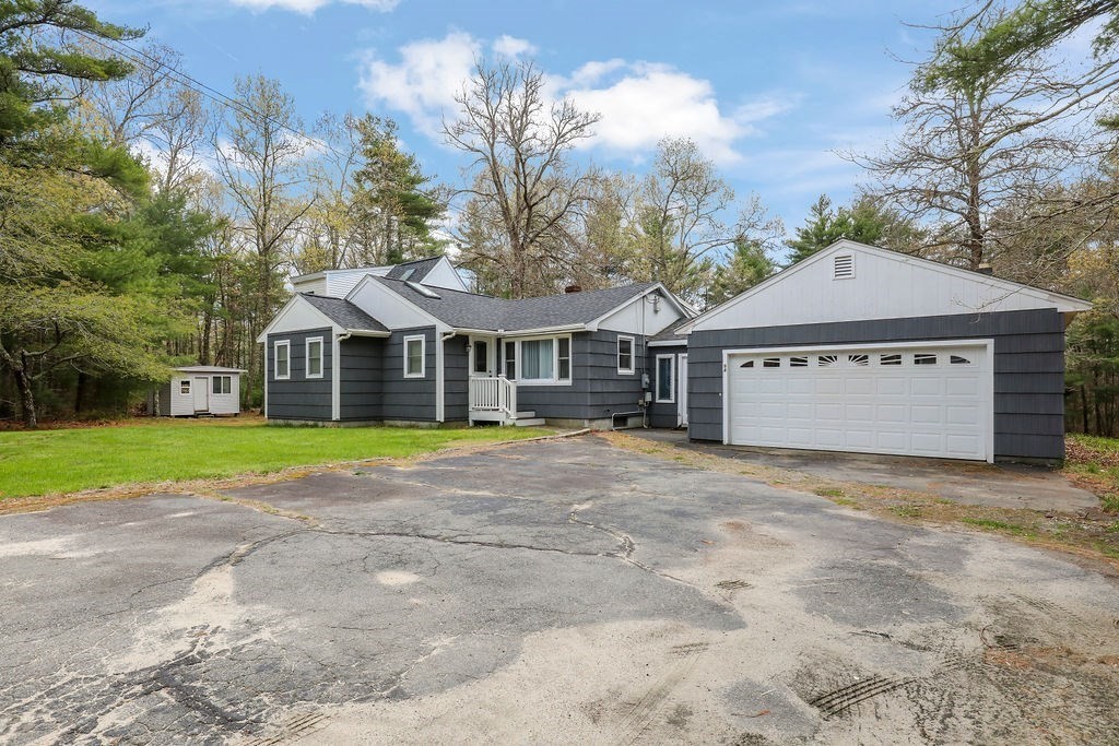94 Fearing Hill Road Wareham, MA 02576 - Photo 2 of 41 a front view of a house with a yard and garage