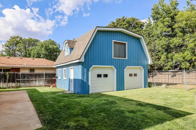 a view of living room with furniture and a fireplace