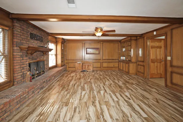 a view of a livingroom with furniture and a fireplace