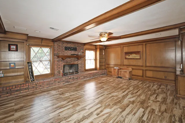 a room with fireplace and windows