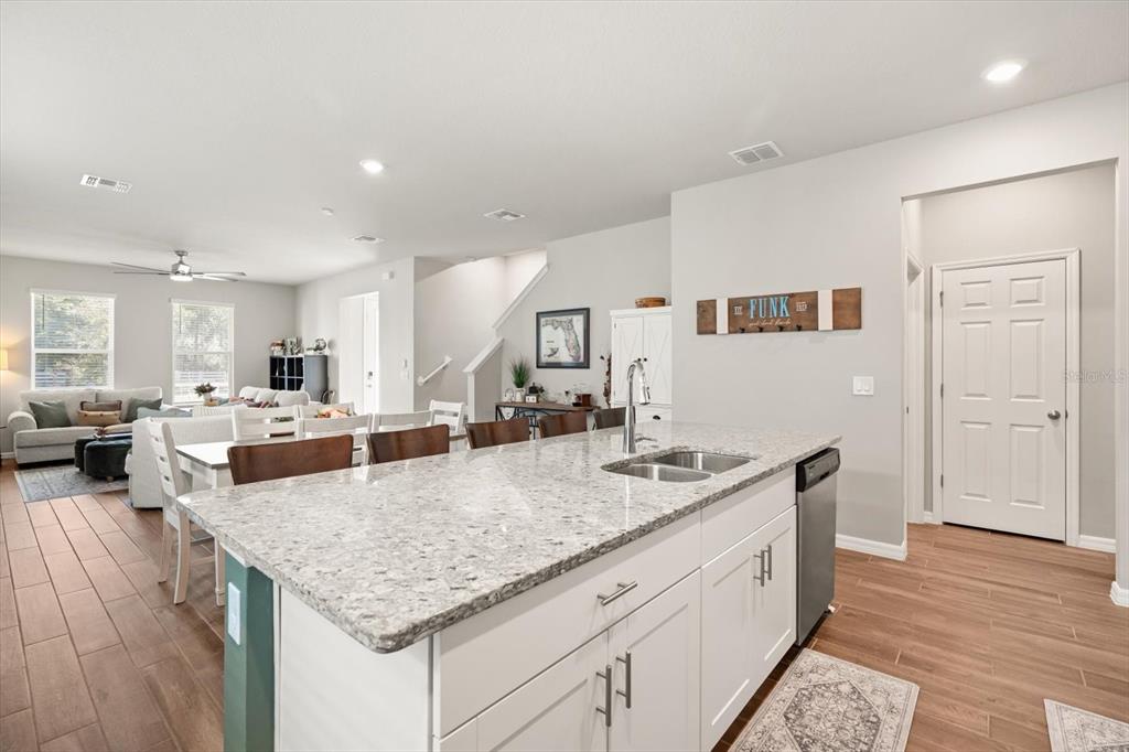 140 South Zuni Road St. Cloud, FL 34771 - Photo 12 of 35 a view of living room with granite countertop furniture and wooden floor
