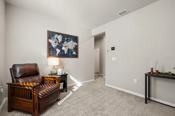 a view of a livingroom with furniture and windows