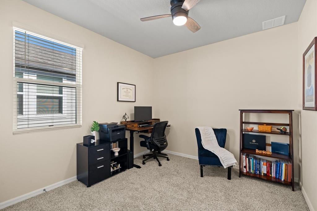 140 South Zuni Road St. Cloud, FL 34771 - Photo 21 of 35 a view of a workspace with furniture