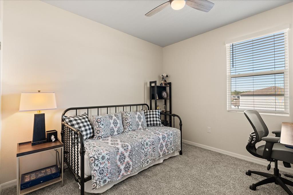 140 South Zuni Road St. Cloud, FL 34771 - Photo 27 of 35 a bedroom with furniture and a window