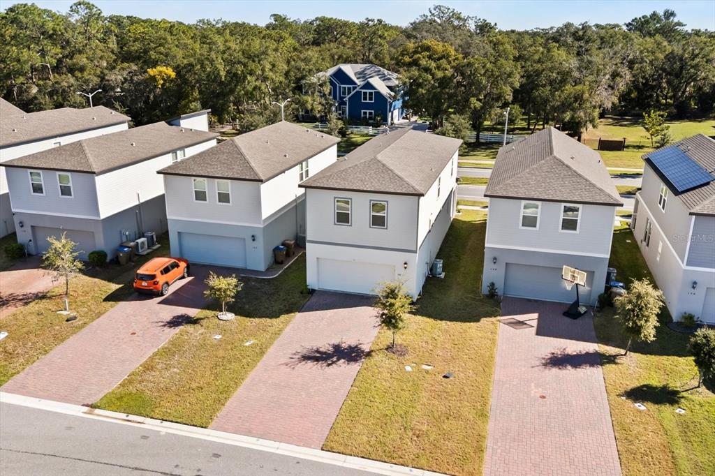 140 South Zuni Road St. Cloud, FL 34771 - Photo 31 of 35 an aerial view of a house with a yard