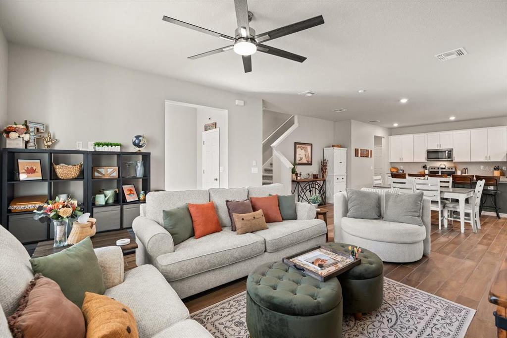 140 South Zuni Road St. Cloud, FL 34771 - Photo 6 of 35 a living room with furniture and kitchen view