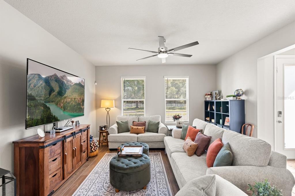 140 South Zuni Road St. Cloud, FL 34771 - Photo 7 of 35 a living room with furniture and a flat screen tv