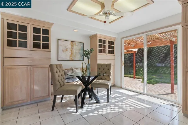 a view of a dining room with furniture window and outside view