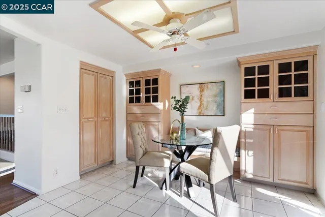 a view of a dining room with furniture and a window