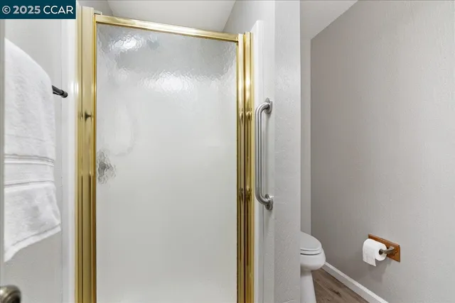 a bedroom with a bed and a lamp