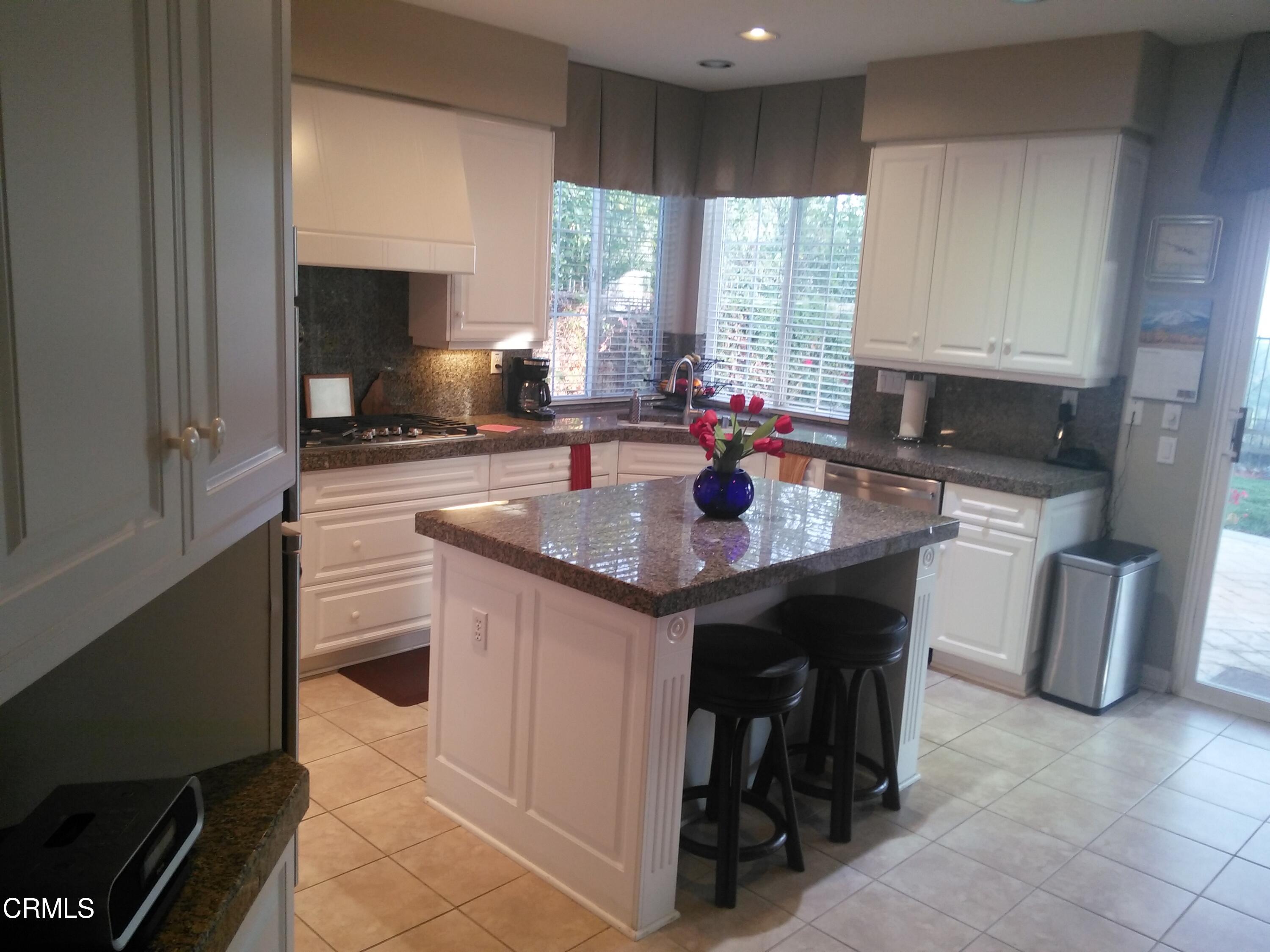 3502 Giddings Ranch Road Altadena, CA 91001 - Photo 13 of 33 a kitchen with a sink a stove and chairs
