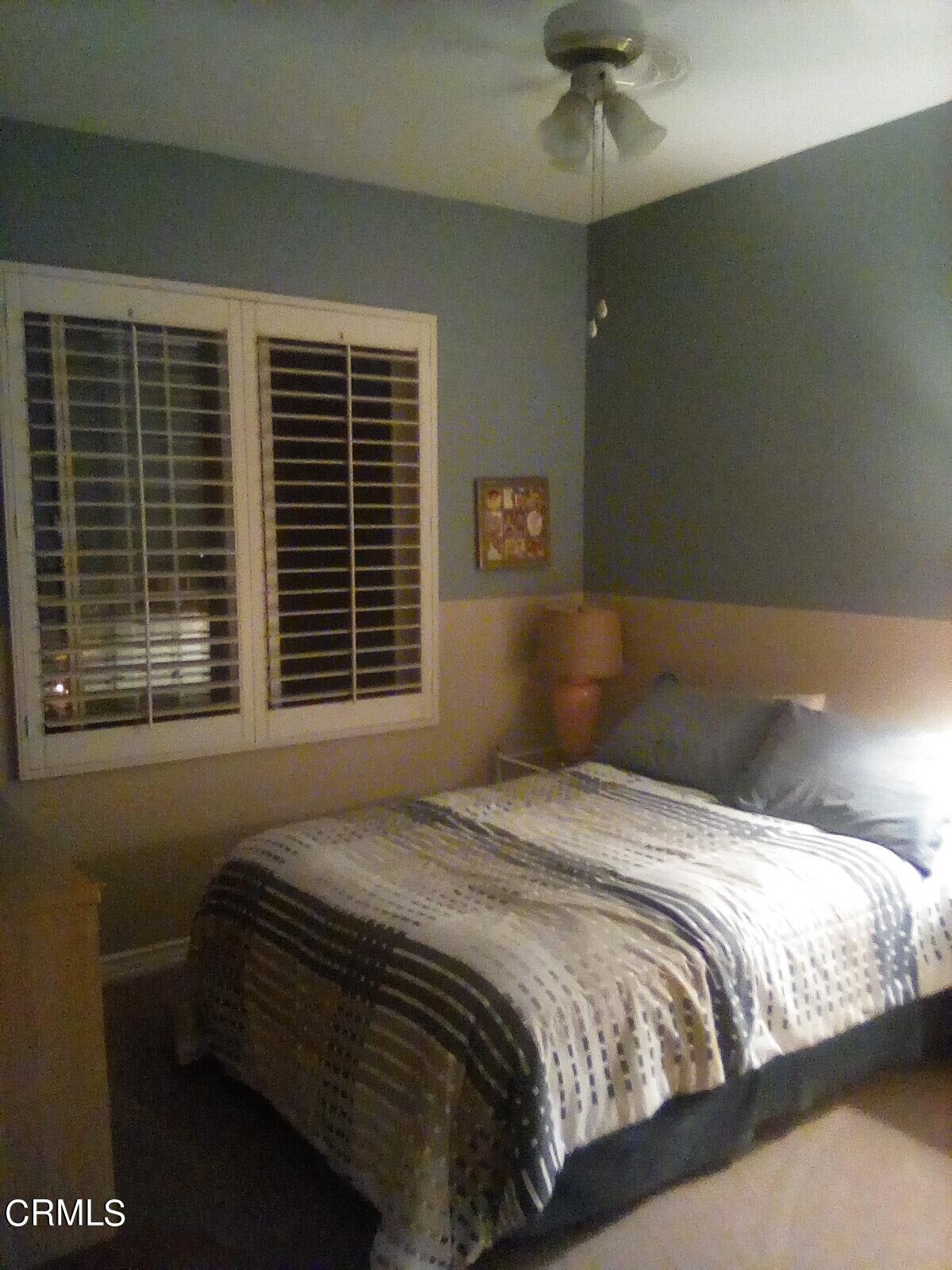 3502 Giddings Ranch Road Altadena, CA 91001 - Photo 22 of 33 a bedroom with a bed and a window