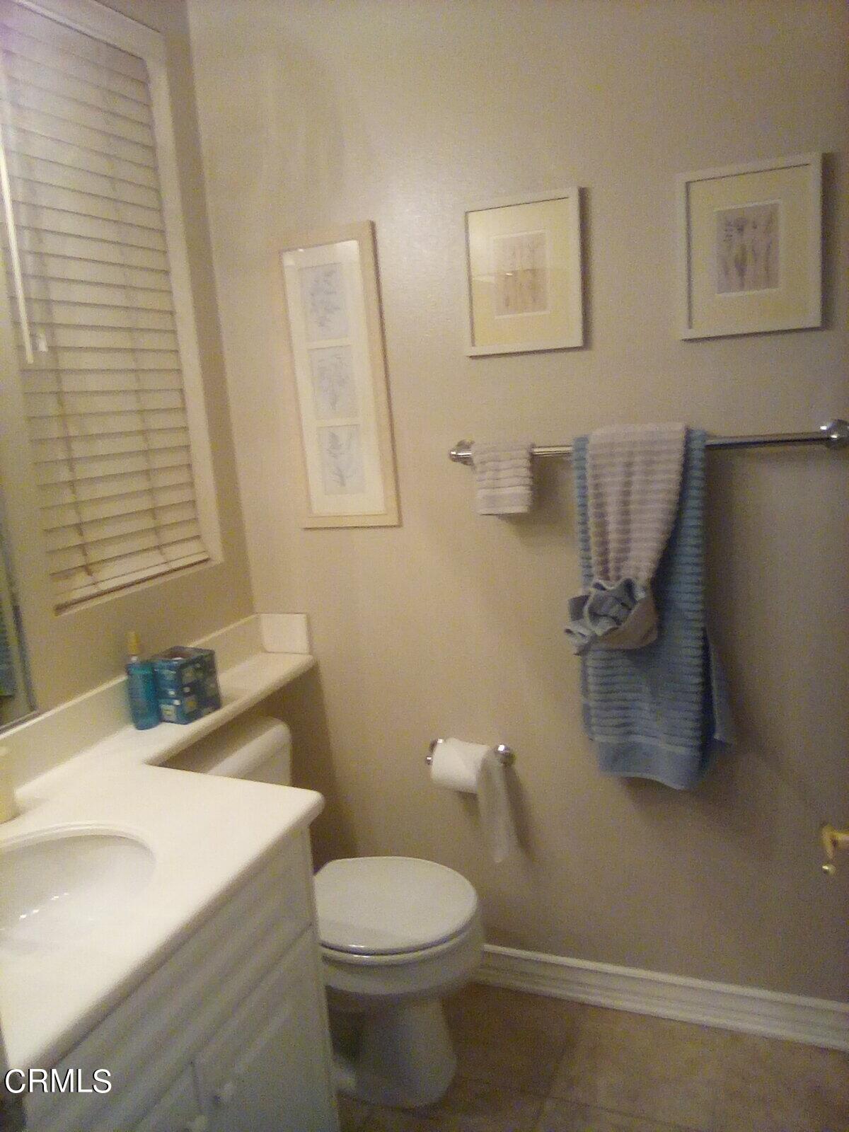 3502 Giddings Ranch Road Altadena, CA 91001 - Photo 24 of 33 a bathroom with a sink a toilet and mirror