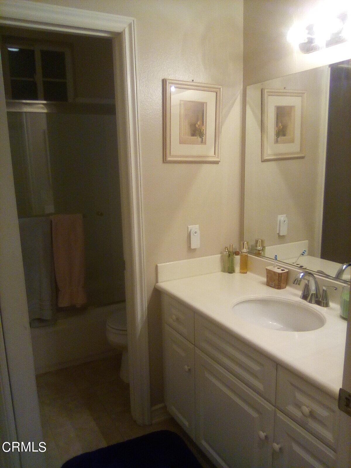 3502 Giddings Ranch Road Altadena, CA 91001 - Photo 26 of 33 a bathroom with a sink and mirror
