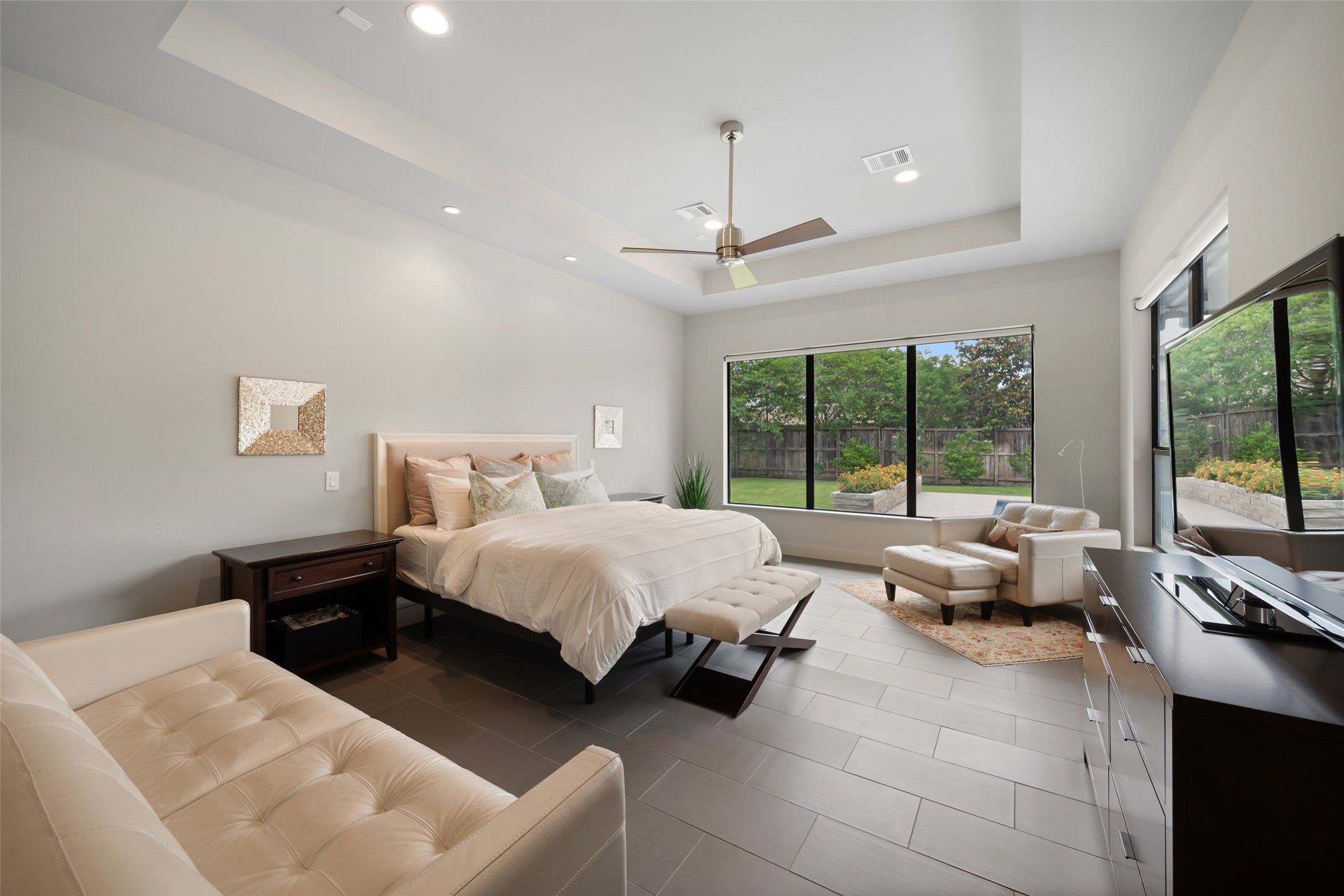 24902 Delaney Knoll Spring, TX 77389 - Photo 15 of 49 a spacious bedroom with a bed and glass window