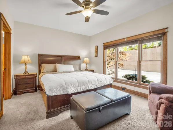 a bedroom with a bed and dresser