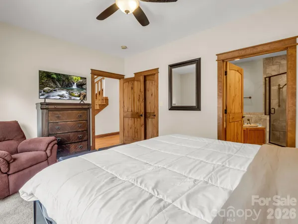 a spacious bathroom with a double vanity sink tub and mirror