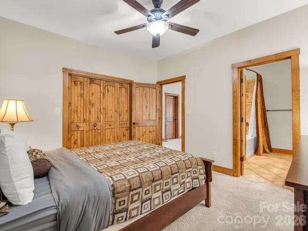 a view of kitchen with stainless steel appliances kitchen island granite countertop a stove top oven a sink and a large window