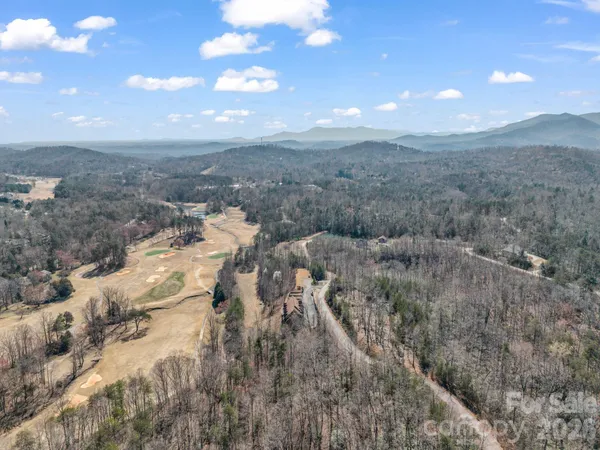 a view of a street with a mountain