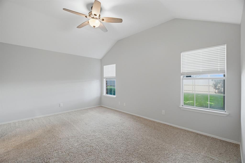 2074 Briarcliff Road Lewisville, TX 75067 - Photo 27 of 40 Vaulted ceiling featuring a ceiling fan with integrated lighting