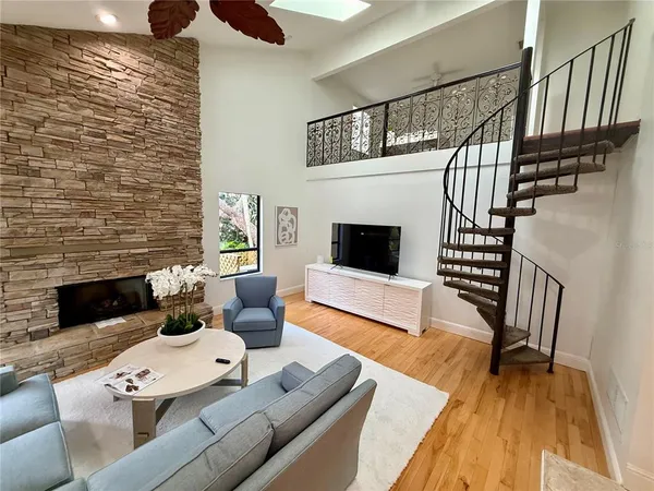 a living room with furniture and a rug