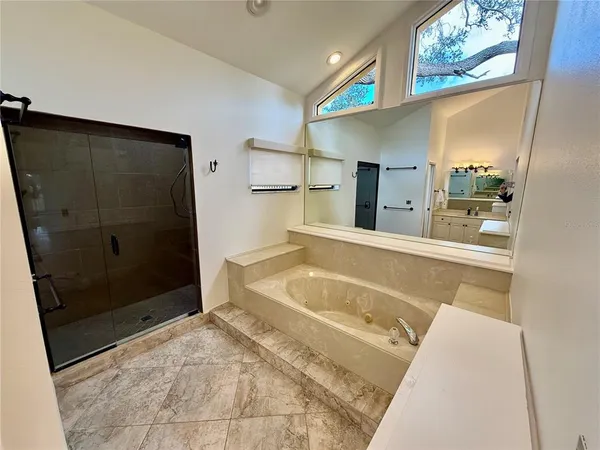 a bedroom with a bed dresser and a window