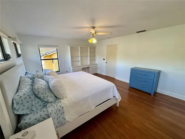 a bedroom with a bed and window