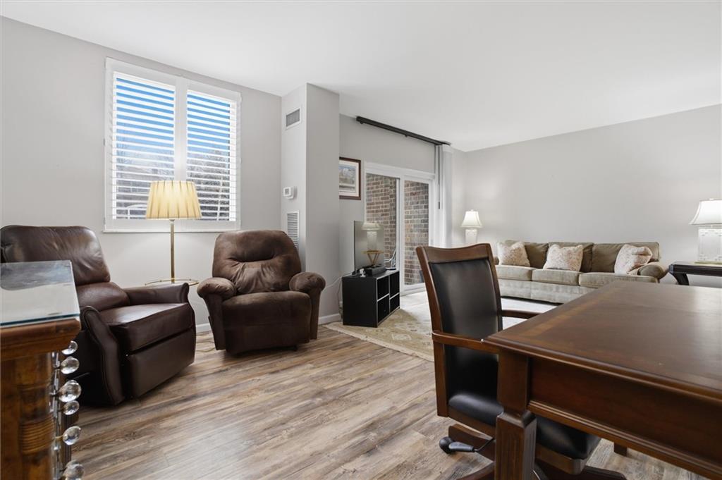 5715 Beacon Street, Unit 107 Pittsburgh, PA 15217 - Photo 17 of 50 a living room with furniture and a window