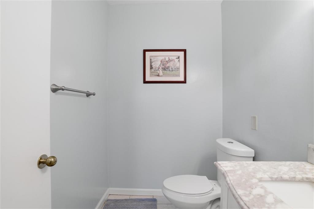 5715 Beacon Street, Unit 107 Pittsburgh, PA 15217 - Photo 26 of 50 a white toilet sitting next to a shower