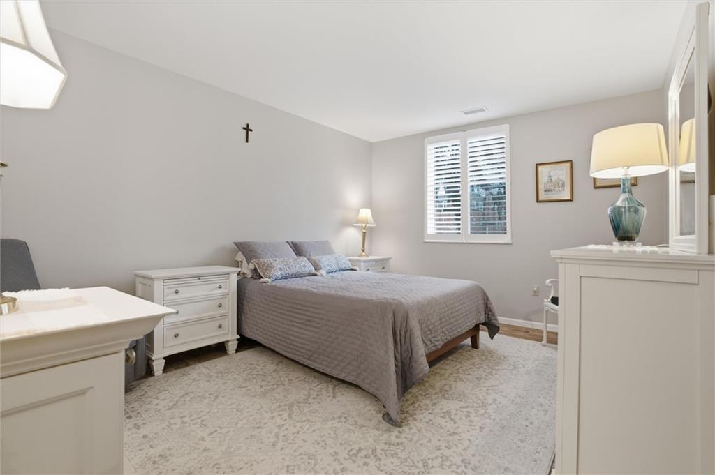 5715 Beacon Street, Unit 107 Pittsburgh, PA 15217 - Photo 27 of 50 a room with a bed and a table