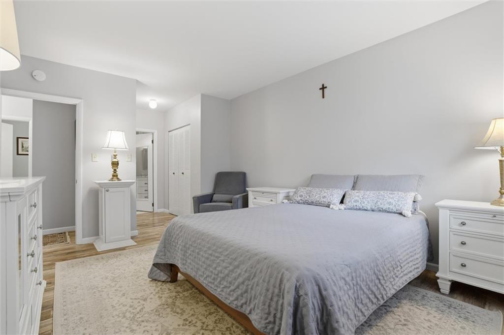 5715 Beacon Street, Unit 107 Pittsburgh, PA 15217 - Photo 28 of 50 a spacious bedroom with a bed and a view of living room