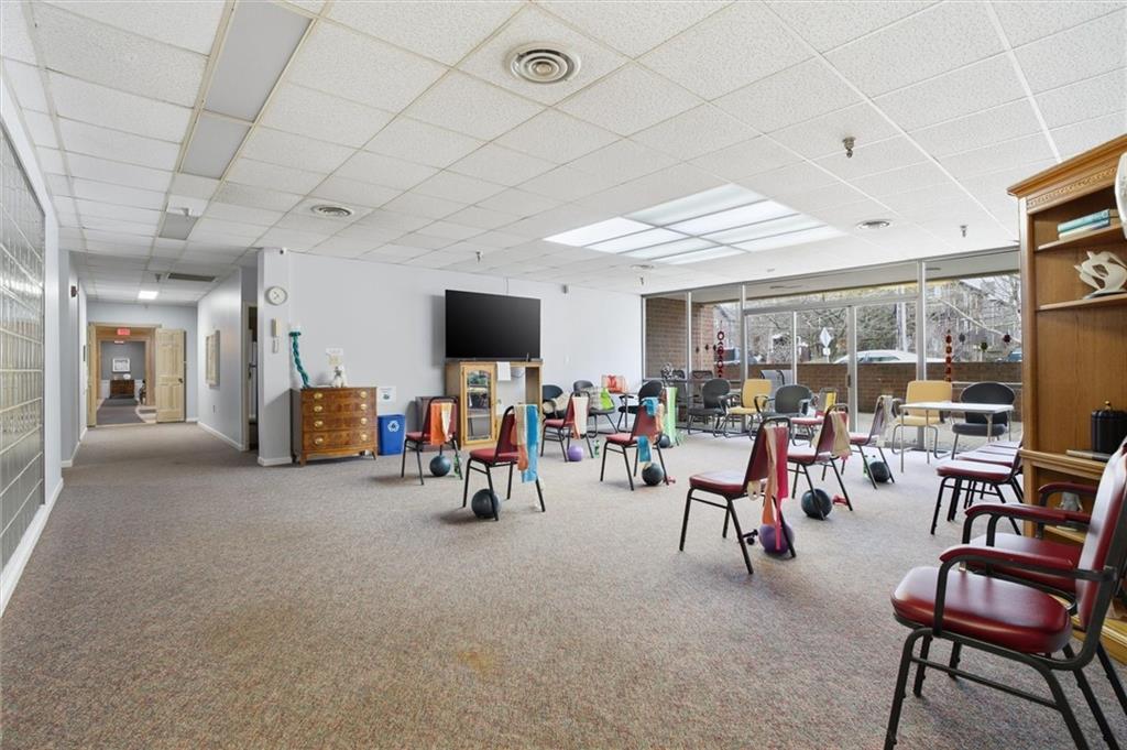 5715 Beacon Street, Unit 107 Pittsburgh, PA 15217 - Photo 44 of 50 a view of a room with furniture and a flat screen tv