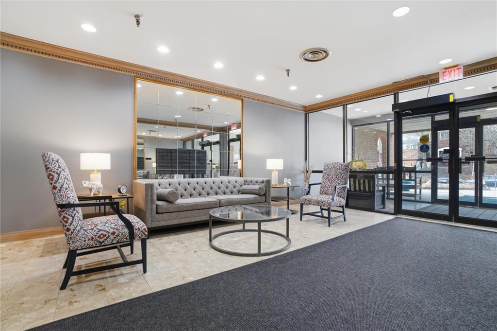 5715 Beacon Street, Unit 107 Pittsburgh, PA 15217 - Photo 5 of 50 a living room with furniture and a large window
