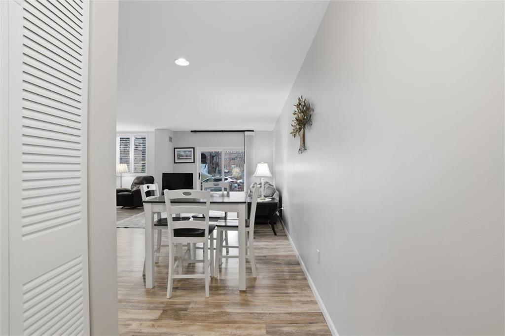 5715 Beacon Street, Unit 107 Pittsburgh, PA 15217 - Photo 9 of 50 a view of a dining room with furniture and wooden floor