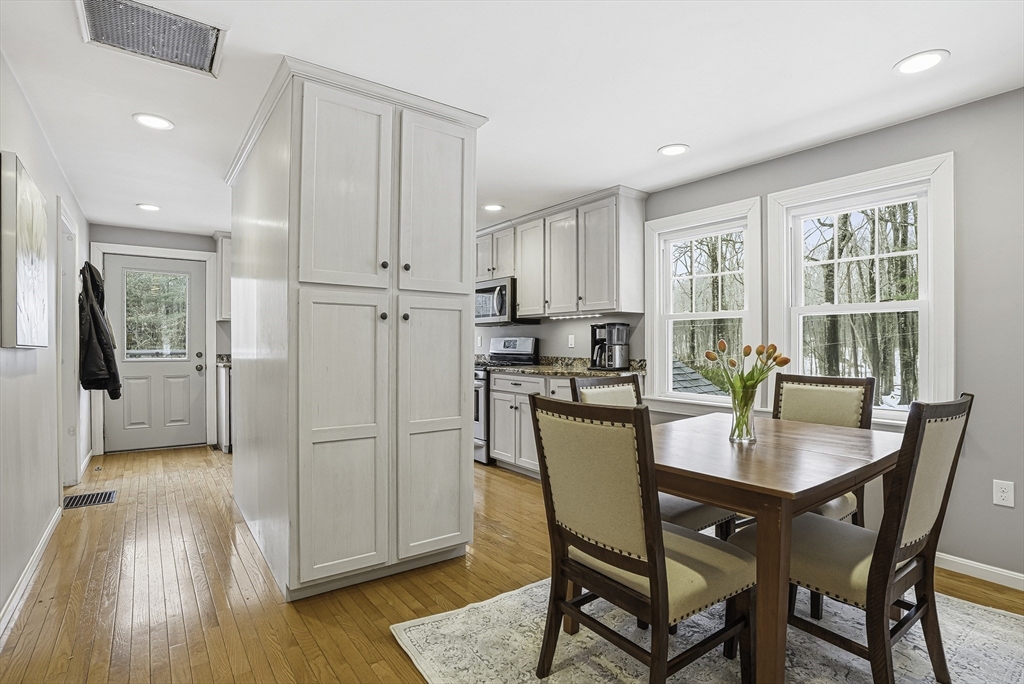 300 West Main Street Hopkinton, MA 01748 - Photo 11 of 28 a view of a dining room with furniture window and wooden floor