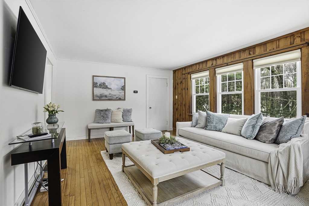 300 West Main Street Hopkinton, MA 01748 - Photo 15 of 28 a living room with furniture and a flat screen tv