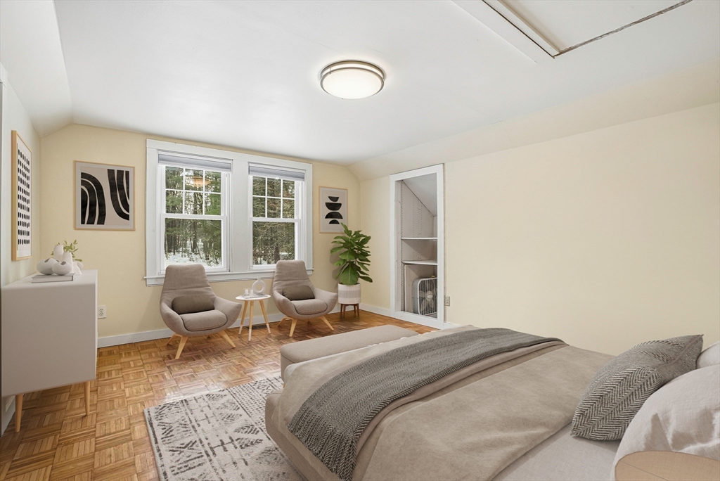 300 West Main Street Hopkinton, MA 01748 - Photo 16 of 26 a bedroom with a bed and wooden floor