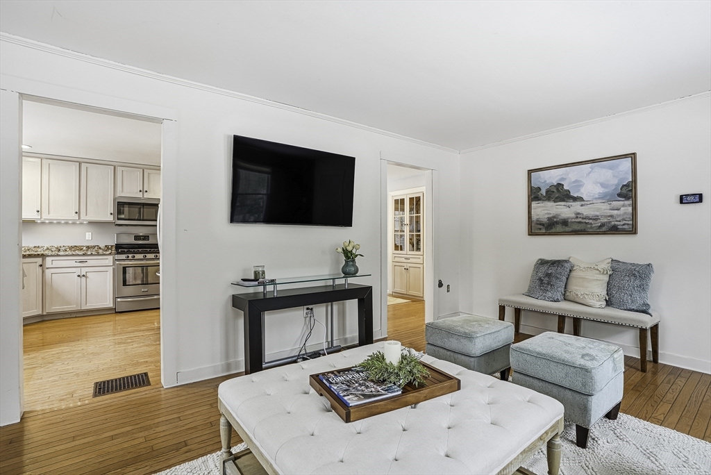 300 West Main Street Hopkinton, MA 01748 - Photo 17 of 28 a living room with furniture and a flat screen tv