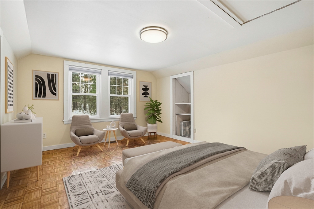 300 West Main Street Hopkinton, MA 01748 - Photo 21 of 28 a bedroom with a bed and wooden floor