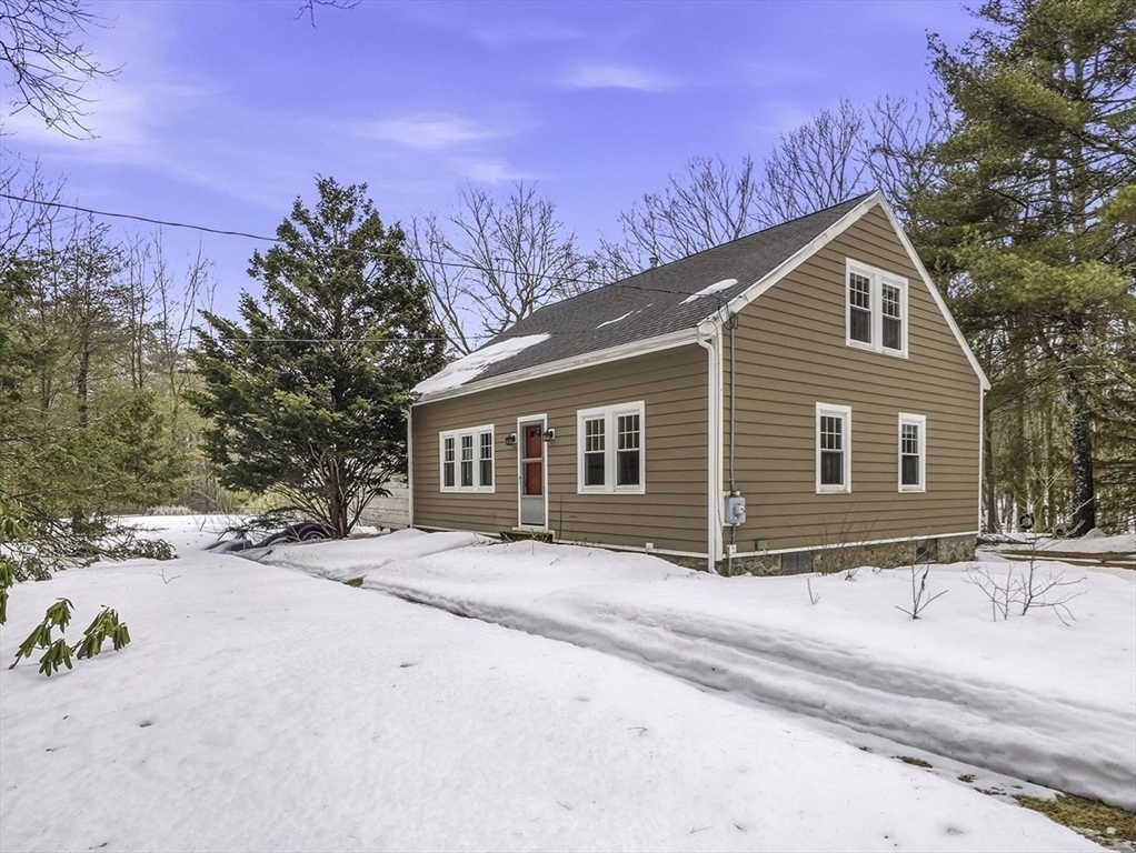 300 West Main Street Hopkinton, MA 01748 - Photo 24 of 28 a view of a house with a yard covered in snow