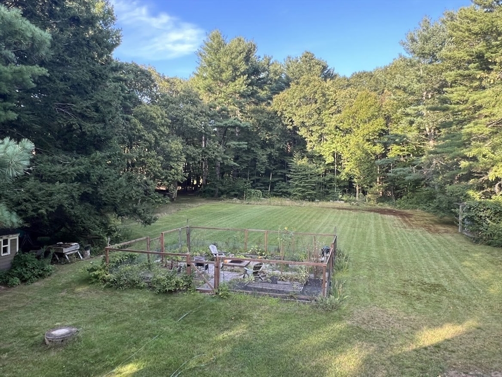 300 West Main Street Hopkinton, MA 01748 - Photo 5 of 28 a view of a lake with a yard
