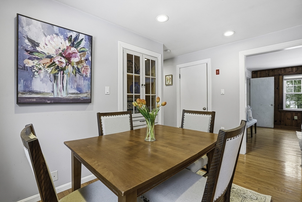 300 West Main Street Hopkinton, MA 01748 - Photo 7 of 26 a view of a dining room with furniture and wooden floor