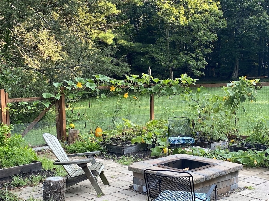 300 West Main Street Hopkinton, MA 01748 - Photo 7 of 28 a garden with plants and outdoor seating