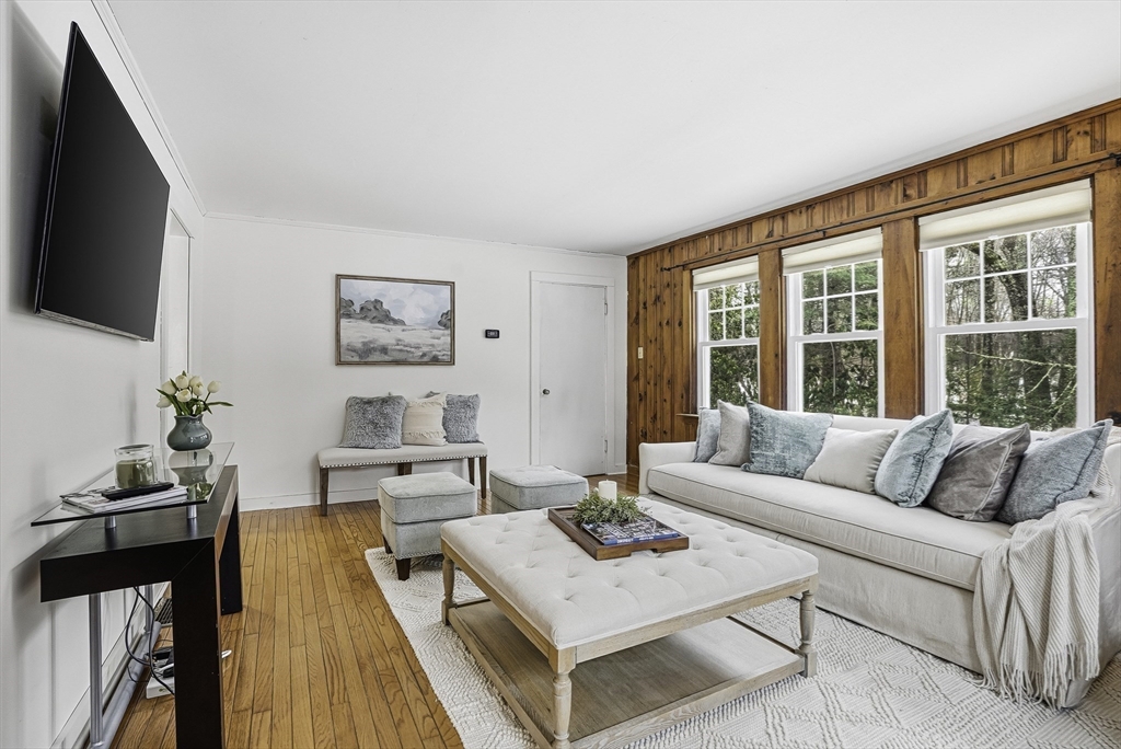 300 West Main Street Hopkinton, MA 01748 - Photo 9 of 26 a living room with furniture and a flat screen tv