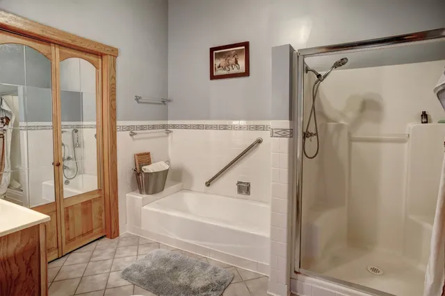 a bathroom with a bathtub and a shower