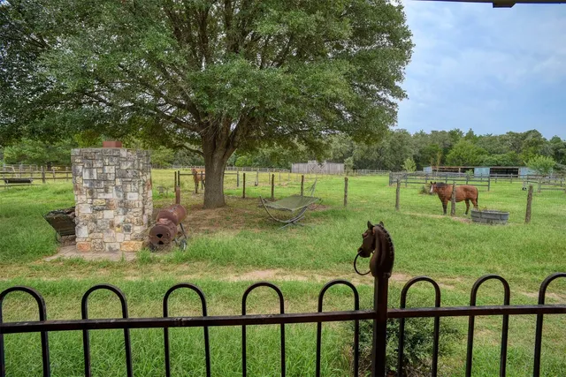 a view of yard with seating area and green space