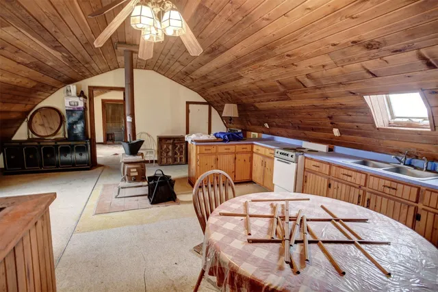 a view of a livingroom with furniture and workspace