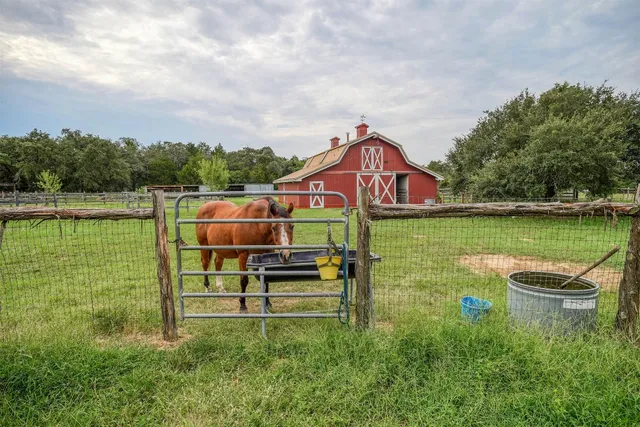 a view of a lake with a house in the background