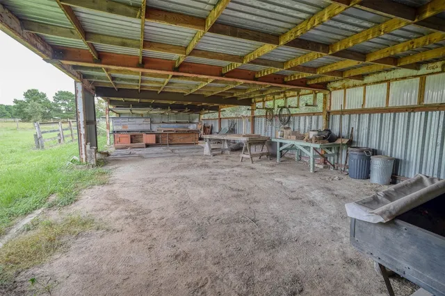 a view of a backyard with sitting area